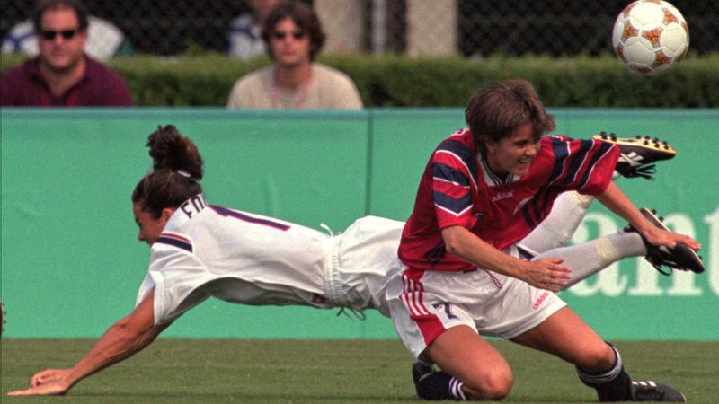 Norway's Anne Nymark Andersen (right) and the United States' Julie Foudy fight for the the ball during first half action in the Olympic women's soccer semifinal Sunday, July 28, 1996, at Sanford Stadium in Athens. (Michel Lipchitz/AP)
