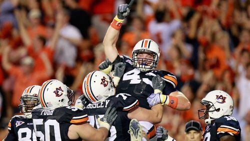 Philip Lutzenkirchen, No. 43, of course, pictured here in a moment of celebration at Auburn,  died in a single car accident in the summer of 2014. (Kevin C. Cox/Getty Images)