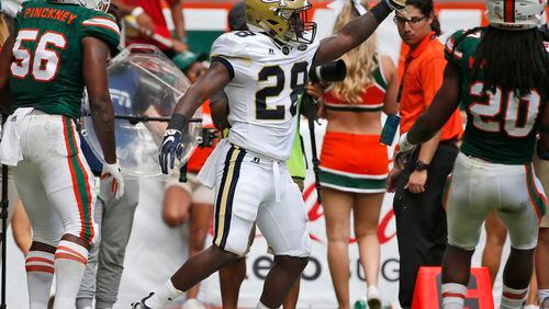 Georgia Tech running back J.J. Green (28) celebrates after scoring during the first quarter of Saturday's game in Miami Gardens, Fla. (AP Photo/Wilfredo Lee)