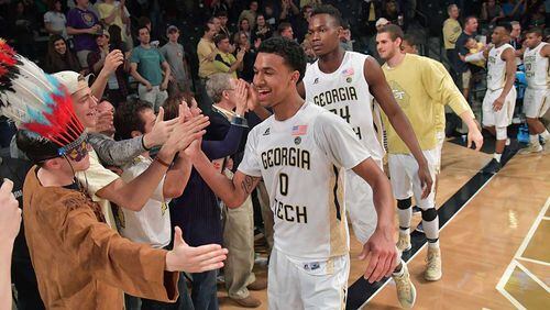 Justin Moore (0) and other team members celebrate with fans after the Jackets' home win over Boston College in February.