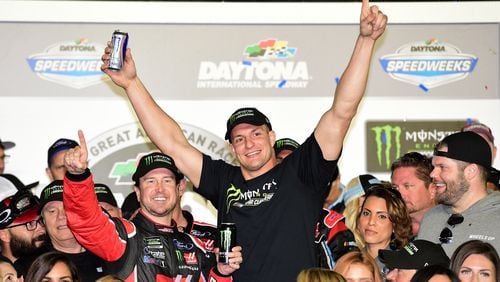 Daytona 500 winner Kurt Busch celebrates his Daytona 500 win with New England Patriots tight end Rob Gronkowski. (Jared C. Tilton/Getty Images)