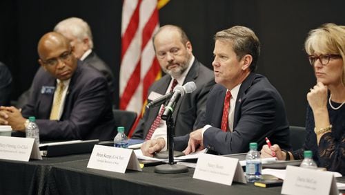 Secretary of State Brian Kemp (center right) and state Rep. Barry Fleming, R-Harlem, (center left) led the first meeting of the Secure, Accessible & Fair Elections (SAFE) Commission in Marietta as the panel’s co-chairmen. The committee will study options for the state’s next voting system. Georgia’s current digital voting machines lack a verifiable paper trail to conduct recounts or check the accuracy of election results. Bob Andres / bandres@ajc.com