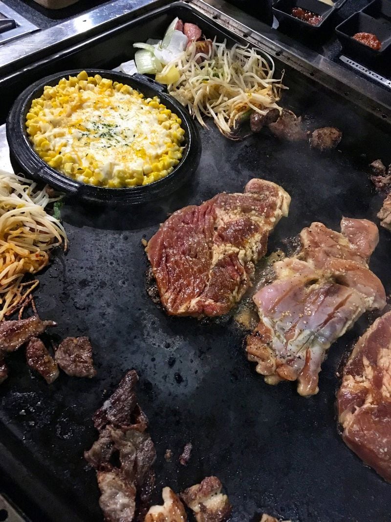The massive tabletop griddles at Miss Gogi allow multiple meats to be cooked at once, with good and bad results. CONTRIBUTED BY WYATT WILLIAMS