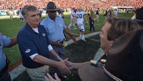 Paul Johnson and Kirby Smart shake hands after Georgia Tech’s 28-27 victory  at Sanford Stadium on Saturday, Nov. 26, 2016.