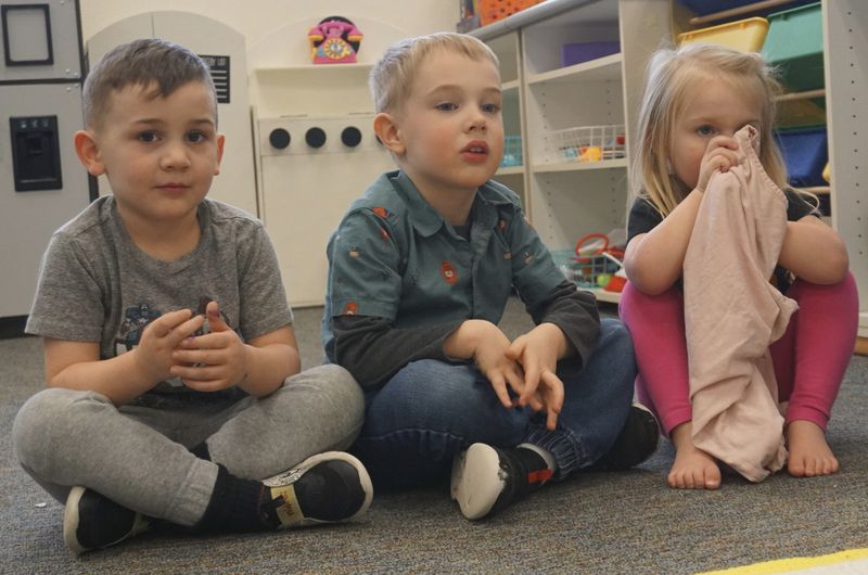 Children listen to their teacher at Endeavor Elementary's onsite daycare on Feb. 29, 2024, in Nampa, Idaho. (Carly Flandro/Idaho Education News via AP)