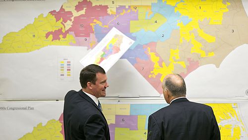 In this 2016 file photo, Republican state Sens. Dan Soucek, left, and Brent Jackson, right, review historical North Carolina maps. Corey Lowenstein/The News &amp; Observer, via AP