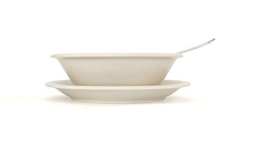 Beige soup plate with spoon and saucer side view (Dreamstime/TNS)