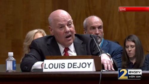 Postmaster General Louis DeJoy speaks before the U.S. Senate during a hearing Tuesday to discuss widespread mail delays.