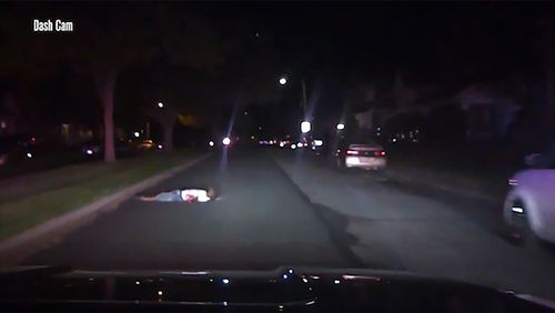 An Ohio police officer has been placed on administrative leave after dashcam video revealed her patrol car ran over a Black man who was lying in the street with gunshot wounds.