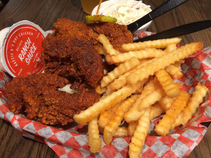 A chicken tender basket with fries and slaw at Hattie B’s. Heat level: medium. CONTRIBUTED BY WENDELL BROCK