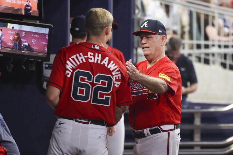 Atlanta Braves starting pitcher AJ Smith-Shawver (62) is greeted by Atlanta Braves manager Brian Snitker after he was removed from the mound during the sixth inning against the Washington Nationals at Truist Park, Friday, June 9, 2023, in Atlanta. The Braves won 3-2. (Jason Getz / Jason.Getz@ajc.com)