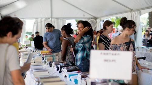 Visitors check out a booth during the 2017 AJC Decatur Book Festival. Now in its 13th year, the annual Labor Day weekend event is the largest independent book festival in the country. CONTRIBUTED BY BRANDEN CAMP