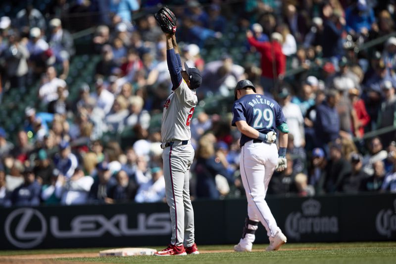 Atlanta Braves pitcher Raisel Iglesias reacts after the final out on Seattle Mariners' Cal Raleigh in the 5-2 win for the Braves in a baseball game, Wednesday, May 1, 2024, in Seattle. (AP Photo/John Froschauer)