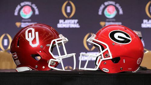 The Georgia and Oklahoma helmets sat side-by-side on a  table during Rose Bowl press conferences in Los Angeles.
