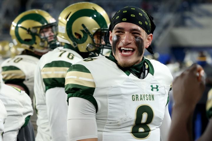 Dec. 30, 2020 - Atlanta, Ga: Grayson quarterback Jake Garcia (8) celebrates a touchdown with offensive lineman in the first half against Collins Hill during the Class 7A state high school football final at Center Parc Stadium Wednesday, December 30, 2020 in Atlanta. JASON GETZ FOR THE ATLANTA JOURNAL-CONSTITUTION