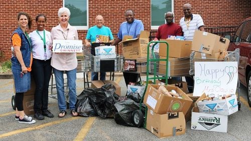 Students at Rock Springs Elementary School recently donated more than 1,300 food items to the Lawrenceville Co-op, in honor of Principal Penny Clavijo's 50th birthday. (Credit: Gwinnett County Public Schools)