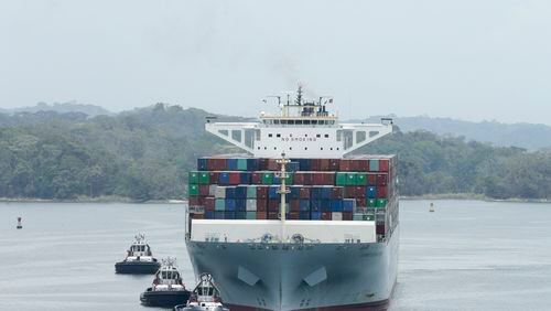 The Neopanamax Cosco Development cargo ship sails in Gatun Lake as it lines up to make it through Agua Clara locks on the newly expanded Canal in, Panama, Tuesday, May, 2, 2017. The Cosco Development is the biggest ship that has gone through the expanded Canal since its inauguration on June 2016. (AP Photo/Arnulfo Franco)