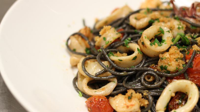 Linguini Con Nero di Seppia e Gamberi from Baraonda in Midtown. Chef Costanzo Astarita pairs linguini with sauce of calamari and shrimp cooked with white wine, Calabrese peppers and other seasonings. Read more about the black pasta trend and places to try it in Atlanta here.Photo credit: Eddie Johnson/ Styling credit: Chef Costanzo Astarita