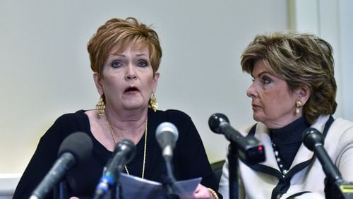 Beverly Young Nelson (left), who accused Alabama U.S. Senate candidate Roy Moore of sexually assaulting her when she was 16 years old, speaks as her attorney, Gloria Allred, watches during a press conference to present expert evidence that Moore signed Nelson’s yearbook. Alabama voters will choose Tuesday between Democrat Doug Jones and the GOP’s Moore, who faces several other accusations of sexual misconduct involving teenage girls when he was in his 30s. HYOSUB SHIN / HSHIN@AJC.COM