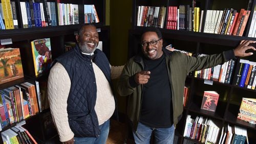 Brothers Darrick Hargro (left) and Carlton Hargro at Moods Music, where they celebrated the release of their comic book “Moses,” one of three titles they published this year featuring African-American superheroes. HYOSUB SHIN / HSHIN@AJC.COM