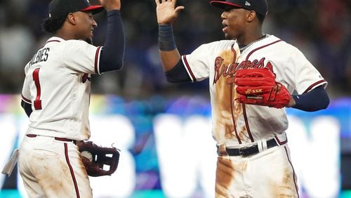 Atlanta Braves Ronald Acuna Jr. and Ozzie Albies celebrate a 4-1 victory over the Chicago Cubs  on Wednesday, May 16, 2018, in Atlanta.