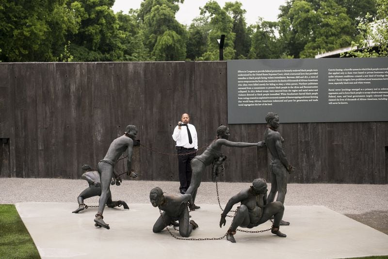 A sculpture commemorating the slave trade stands at the entrance to the lynching memorial. Conceived by the Equal Justice Initiative, the physical environment is intended to foster reflection on America’s history of racial inequality. (Bob Miller / Getty Images)