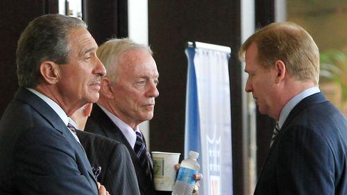 Falcons owner Arthur Blank (left), Dallas Cowboys owner Jerry Jones, and NFL Commissioner Roger Goodell have a conversation in the hallway outside the NFL Owners meetings at the Atlanta Airport Gateway Marriott in Atlanta on Thursday, July 21, 2011.   Curtis Compton ccompton@ajc.com