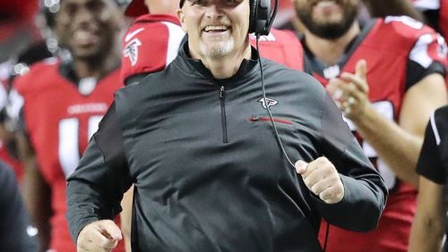 Falcons coach Dan Quinn is all smiles running down the sidelines during a 23-17 victory over the Redskins in an NFL preseason football game Thursday, August 11, 2016, in Atlanta. Curtis Compton /ccompton@ajc.com