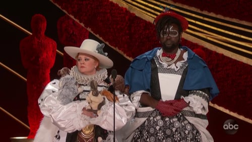 Melissa McCarthy, who shoots so many films in Atlanta that she purchased a home here, and Morehouse College grad and "Atlanta" star Brian Tyree Henry introduce the best costume design category with a little costuming themselves. "Black Panther" won.