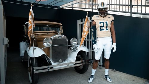 Georgia Tech wide receiver Stephen Dolphus models the gold jersey that the Yellow Jackets will wear in their September 14, 2019 home game against The Citadel. (Santino Stancato/Georgia Tech Football)