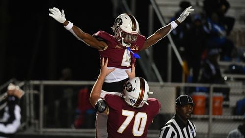 Makhail Wood, wide receiver for Mill Creek, celebrates a touchdown during the Westlake vs. Mill Creek High School Football game on Friday, Nov. 25, 2022, at Mill Creek High School in Hoschton, Georgia. (Jamie Spaar for the Atlanta Journal Constitution)