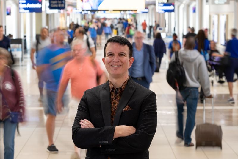 Joe Leader, CEO of the Airline Passenger Experience Association, pauses for a portrait before heading to the gate at Hartsfield-Jackson International Airport for a day-trip to New York on Sunday, Sept 18, 2022.  Ben Gray for the Atlanta Journal-Constitution