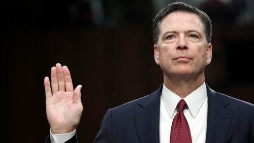 Former FBI Director James Comey is sworn in during a Senate Intelligence Committee hearing on Thursday. AP/Alex Brandon