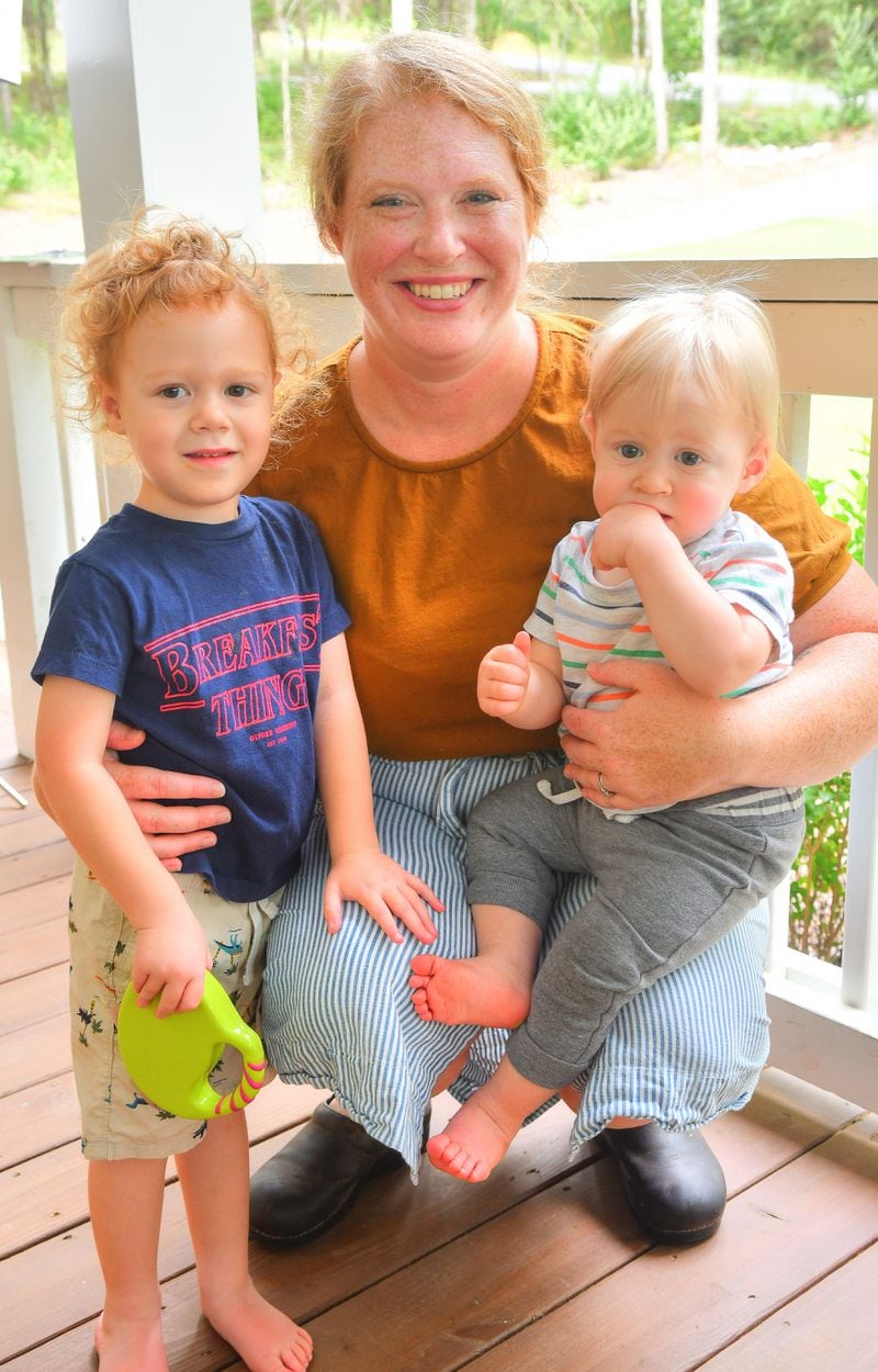 Jessica Rothacker, shown with her children, Fox, 3, and Soren, 1, on the front porch of their Athens home, is a chef and co-owner of Heirloom Cafe and Fresh Market in Athens. CONTRIBUTED BY CHRIS HUNT PHOTOGRAPHY