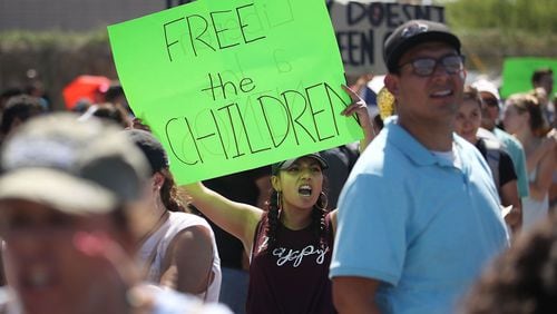 Bianey Reyes, center, and others protest the separation of children from their parents in front of the El Paso Processing Center, an immigration detention facility, at the Mexican border on June 19, 2018, in El Paso, Texas.