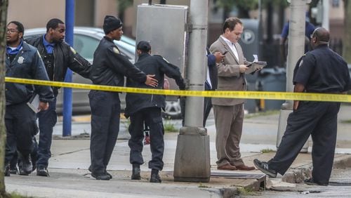 The Fulton County District Attorney’s office came to the scene to investigate three shootings on June 29, including an officer-involved shooting. JOHN SPINK/JSPINK@AJC.COM