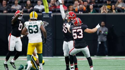 Falcons linebacker Kaden Elliss (55) reacts after a sack against the Green Bay Packers quarterback Jordan Love (10) during the first half against the Green Bay Packers on Sunday, Sept. 17, 2023, at Mercedes-Benz Stadium in Atlanta. Miguel Martinz/miguel.martinezjimenez@ajc.com