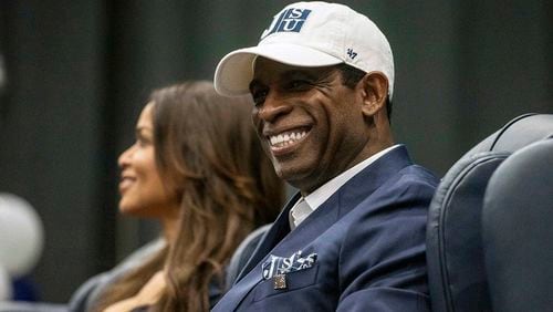Deion Sanders smiles as he is introduced as Jackson State's head football coach at the Lee E. Williams Athletics and Assembly Center at Jackson State University Monday, Sept. 21, 2020, in Jackson, Miss. (Eric Shelton/The Clarion-Ledger)