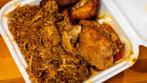 The Caribbean chicken and shrimp from Caribbean Fiesta may not look glamorous, but the tropical flavors sing. Henri Hollis for The Atlanta Journal-Constitution.
