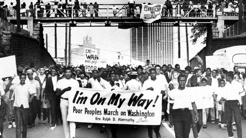 Sign-carrying participants in the Southern leg of the Poor People's Campaign march through Atlanta in their march toward Washington in May 1968.