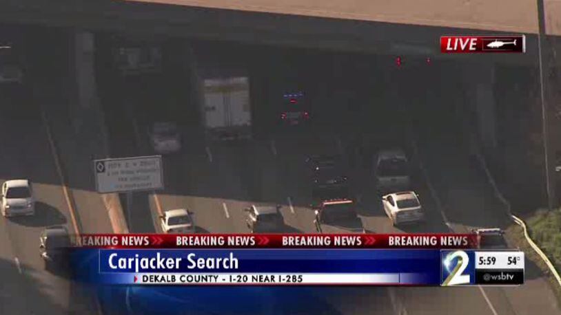 Delays are building on I-20 in DeKalb County after a carjacking arrest.
