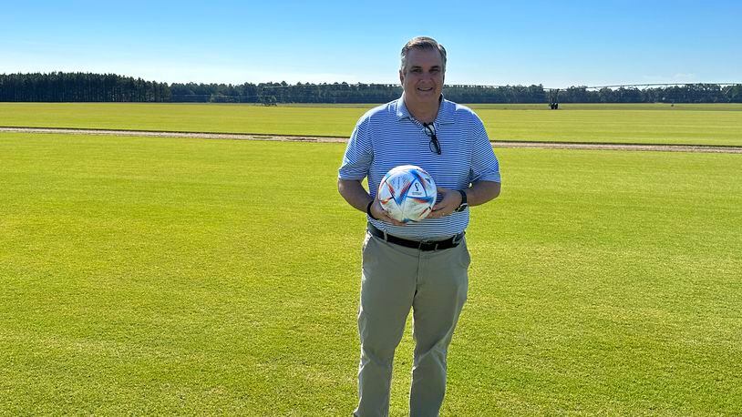 John Holmes, president of Atlas Turf International, poses at Pike Creek Turf in Adel, where Platinum TE Paspalum, a type of grass that will be used at the 81 practice fields and eight stadiums for the World Cup, was grown.
