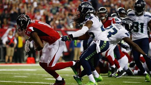 Julio Jones #11 of the Atlanta Falcons scores a touchdown against the Seattle Seahawks at the Georgia Dome on January 14, 2017 in Atlanta, Georgia. (Photo by Gregory Shamus/Getty Images)