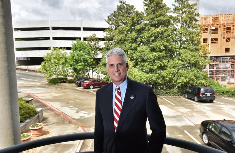 Fred Beloin, part owner of an office building near SunTrust Park, will not be allowed to charge for parking during stadium events because of an ordinance passed by the Cobb County commission in February. Beloin’s office building and parking lot at 2550 Heritage Court is next to the Braves property. HYOSUB SHIN / HSHIN@AJC.COM