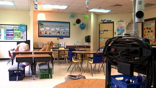 Fulton teachers have been banned from bringing their kids to empty classrooms during virtual learning. (AJC)