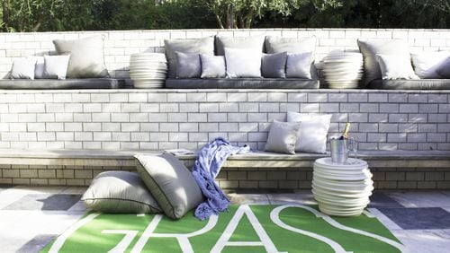 The Grass Green Area Rug from the Robert and Cortney Novogratz’s indoor/outdoor rug line brings a splash of spring to a California patio. CONTRIBUTED BY Robert and Cortney Novogratz
