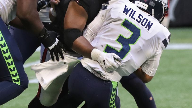 October 27, 2019 Atlanta: Atlanta Falcons defensive tackle Grady Jarrett sacks Seattle Seahawks quarterback Russell Wilson during the third quarter in an NFL football game on Sunday, October 27, 2019, in Atlanta. It had been four games since the Falcons recorded their last sack.   Curtis Compton/ccompton@ajc.com