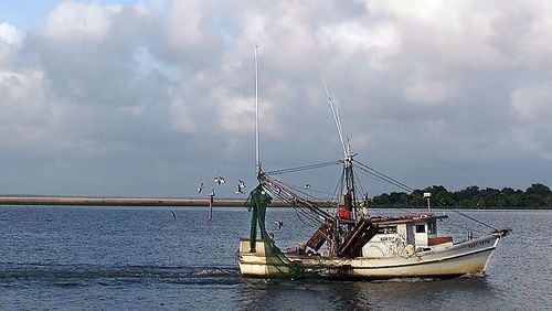 A shrimp boat on the Apalachicola River at sunset.