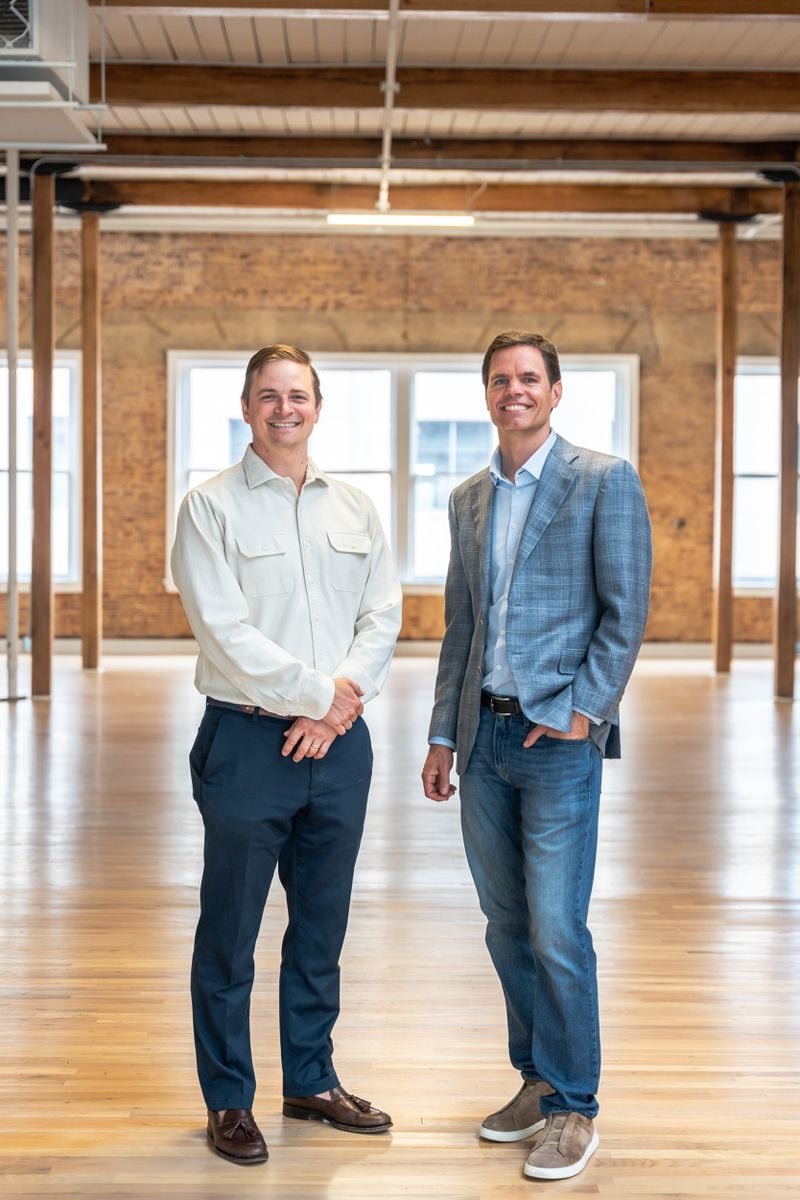 Jon Birdsong (left) and David Cummings inside a property they've acquired during a tour on Thursday, April 11, 2024, in downtown Atlanta. (Atlanta Journal-Constitution/Jason Allen)