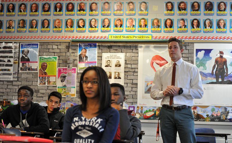 January 15, 2015 Lawrenceville - Andy Dugger (standing), listens to presentation during his AP US History class at Central Gwinnett High School in Lawrenceville on Thursday, January 15, 2015. Some Gwinnett County residents say the school district's history courses, particularly Advanced Placement U.S. History, do not properly reflect many moments and people in American history and much of it is anti-American. The critics want Gwinnett, the state's largest school district, to return to the prior AP U.S. history framework and exam. The criticism in Gwinnett is part of a national debate that's emerged in recent months about the course, led by conservatives, after some changes were made to the coursework in 2014. HYOSUB SHIN / HSHIN@AJC.COM Teacher Andy Dugger (standing) listens to presentation during his AP US History class at Central Gwinnett High School in Lawrenceville. HYOSUB SHIN / HSHIN@AJC.COM